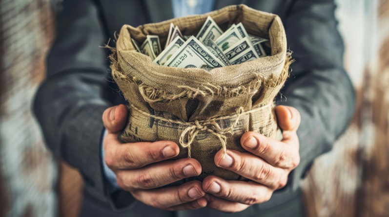 A man offering money.